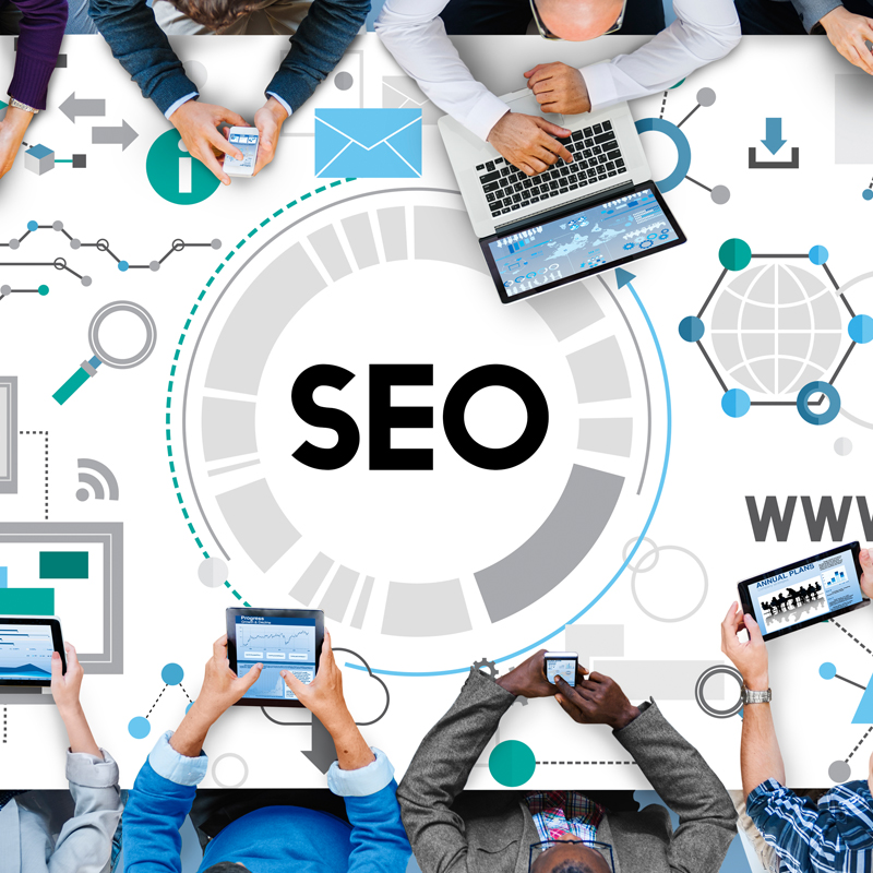 SEO experts analyzing website data and optimizing search rankings on laptop for SEO company in Hyderabad